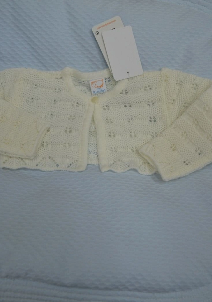 Chaqueta de niña perlé en crudo.